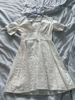 White Textured Mini Dress with V-Neck and Tie Sleeves